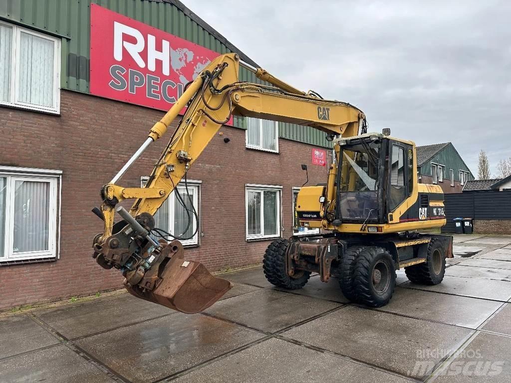 CAT M315 +ROTO CE Hjulgrävare