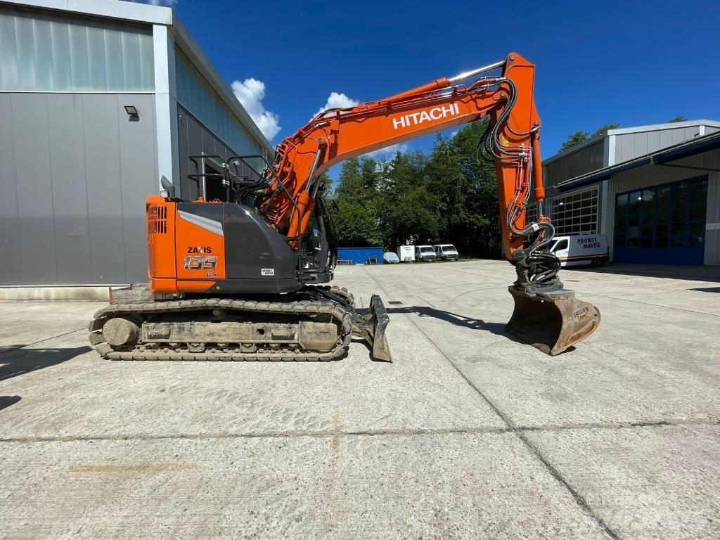 Hitachi ZX135US Bandgrävare