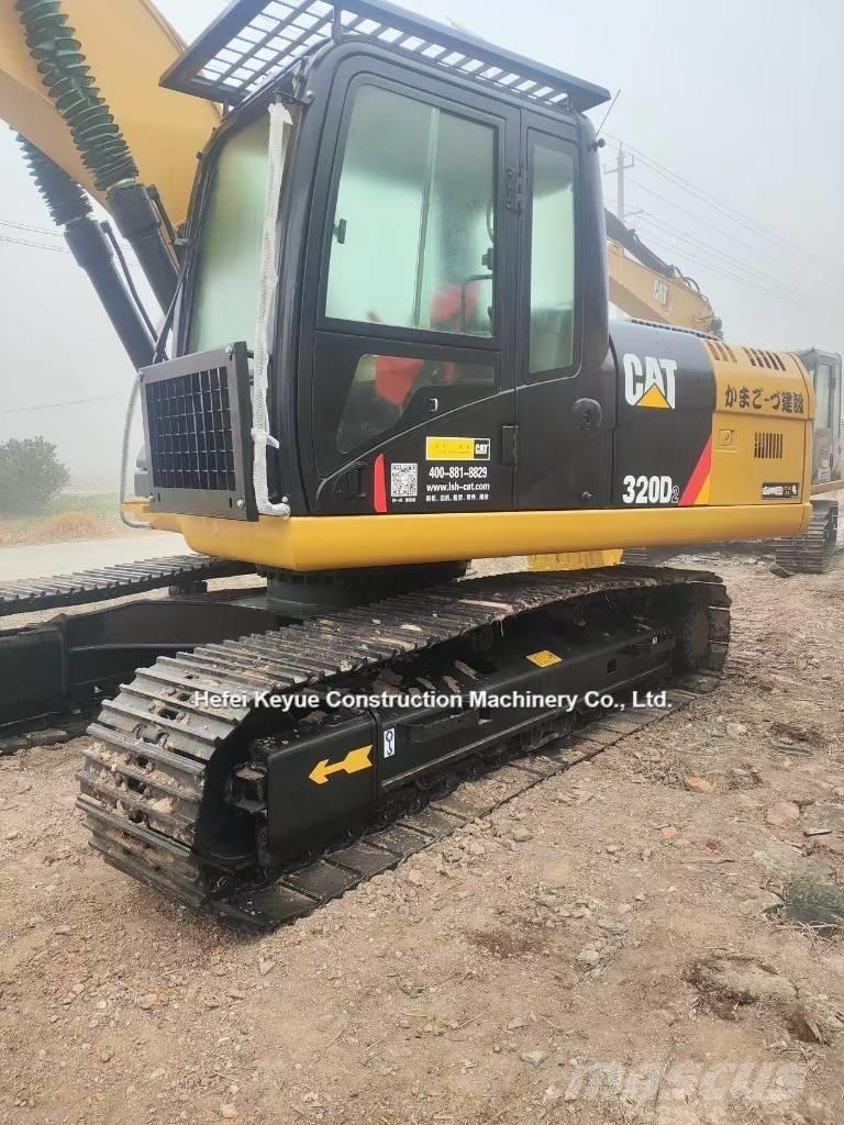 CAT 323 Bandgrävare
