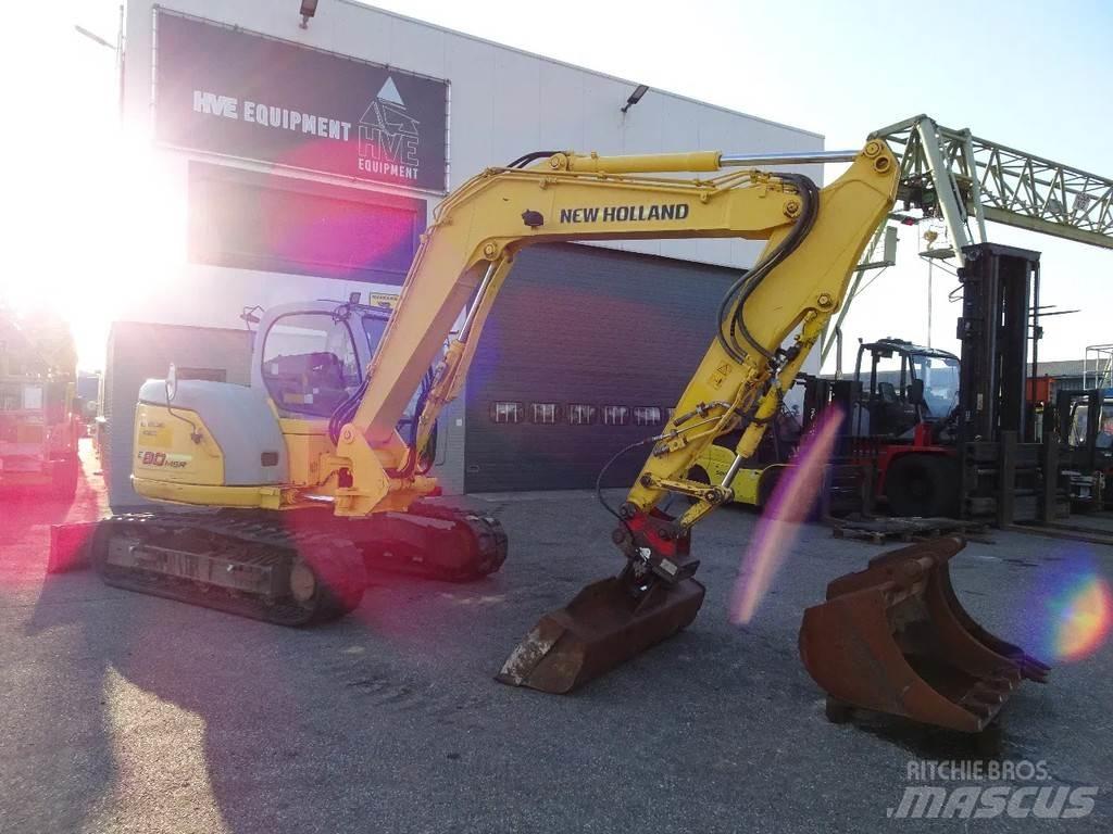 New Holland E80 Bandgrävare