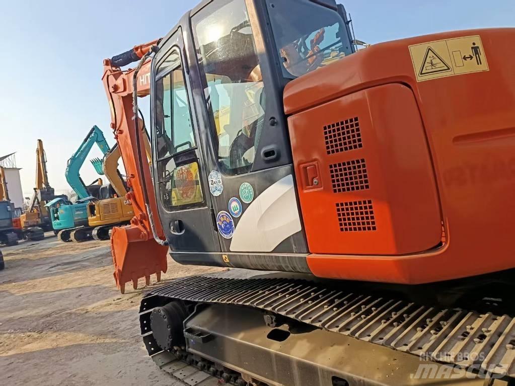 Hitachi ZX135 Bandgrävare