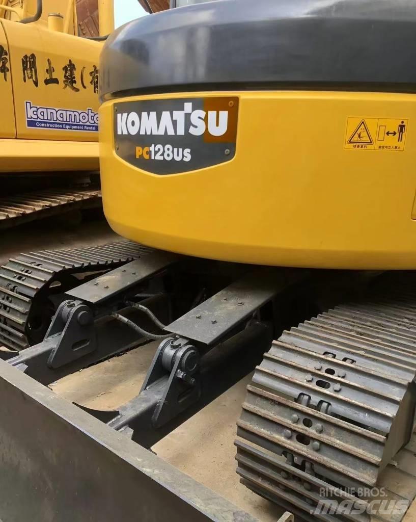 Komatsu 128 US Bandgrävare