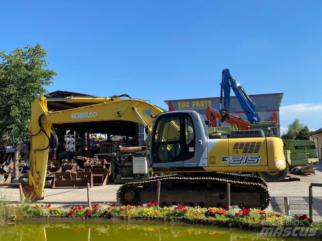New Holland E 215 Bandgrävare