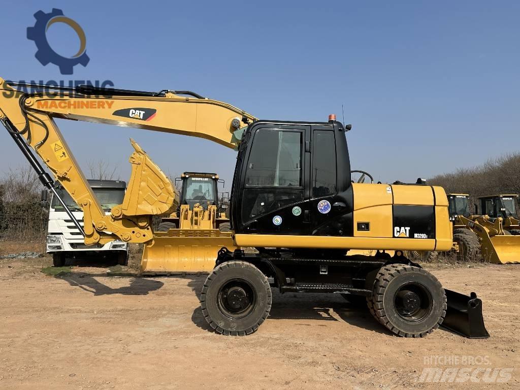CAT M 320 D2 Hjulgrävare