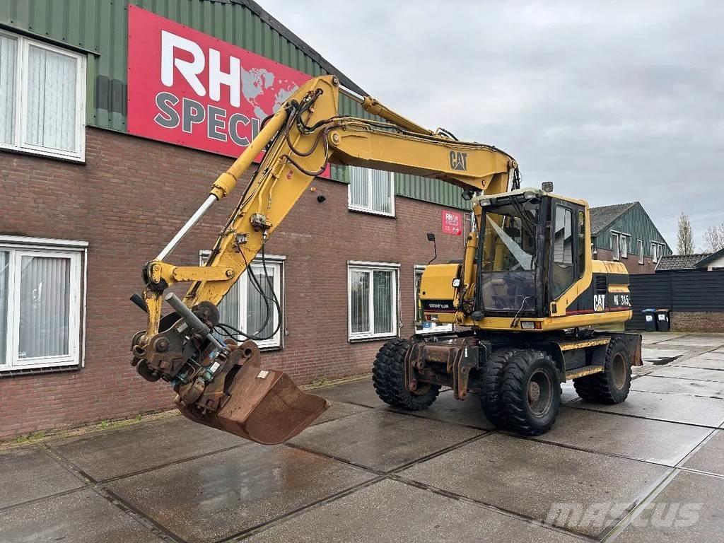 CAT M315 +ROTO CE Hjulgrävare