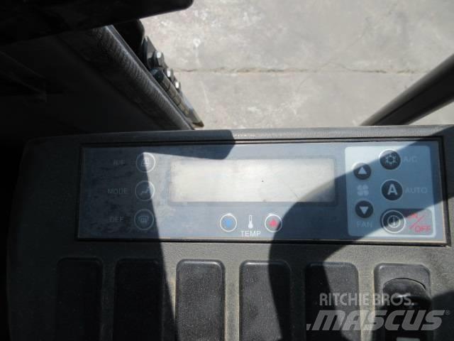 New Holland E 245 Bandgrävare