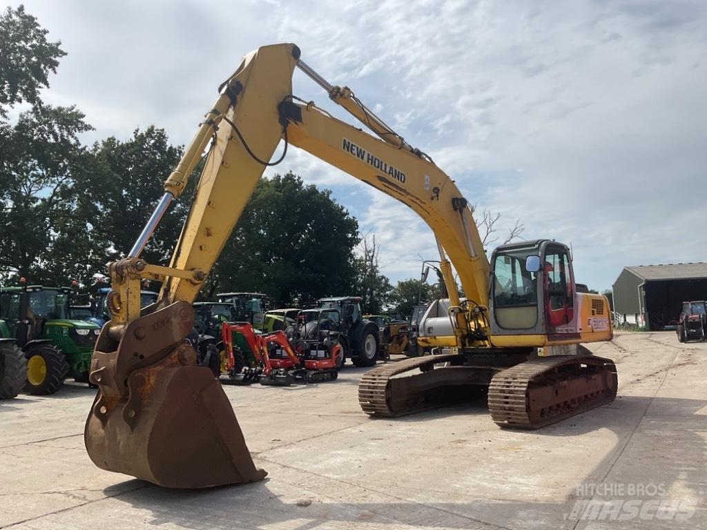 New Holland E 305 Bandgrävare