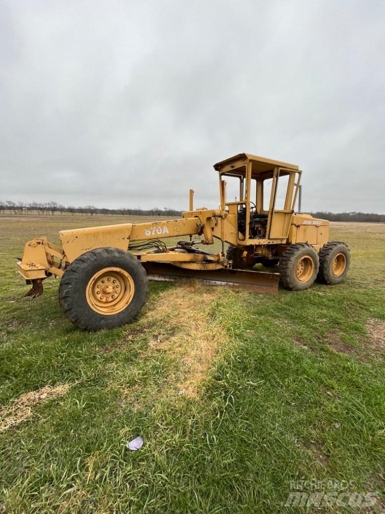 DEERE 570A Väghyvlar
