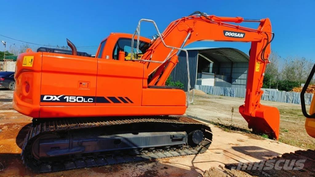 Hitachi ZX 210 Bandgrävare