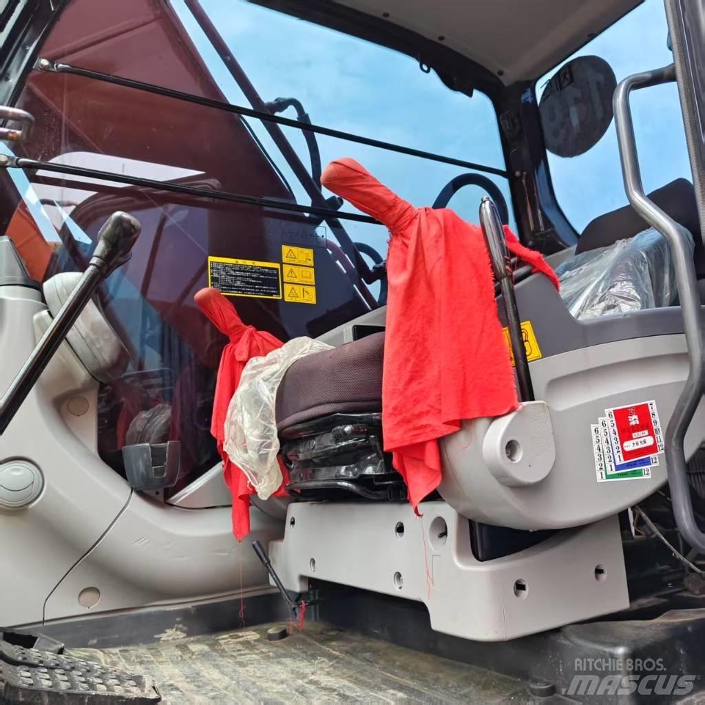 Hitachi ZX 210 Bandgrävare
