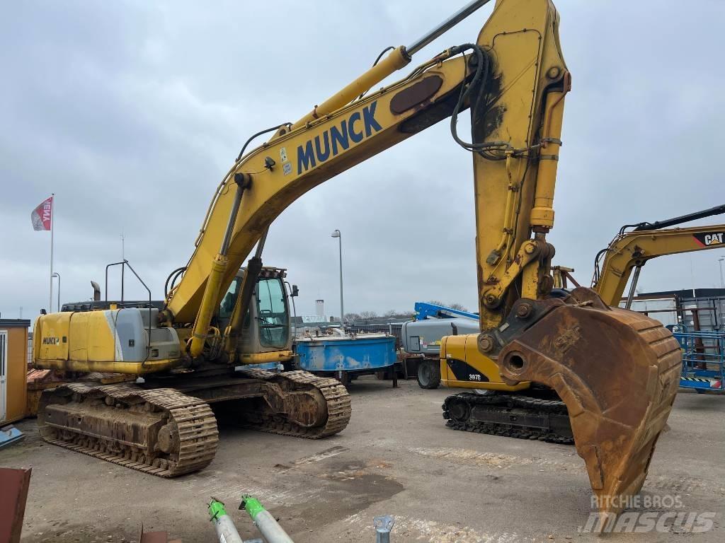 New Holland E 485 Bandgrävare