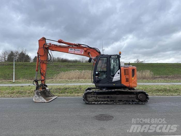 Hitachi ZX135US-5B Bandgrävare