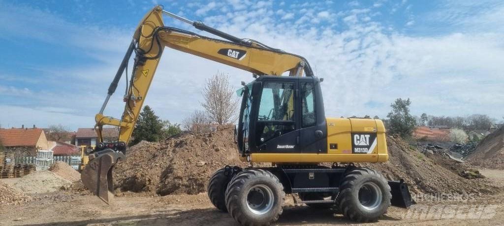 CAT M 313 D Hjulgrävare