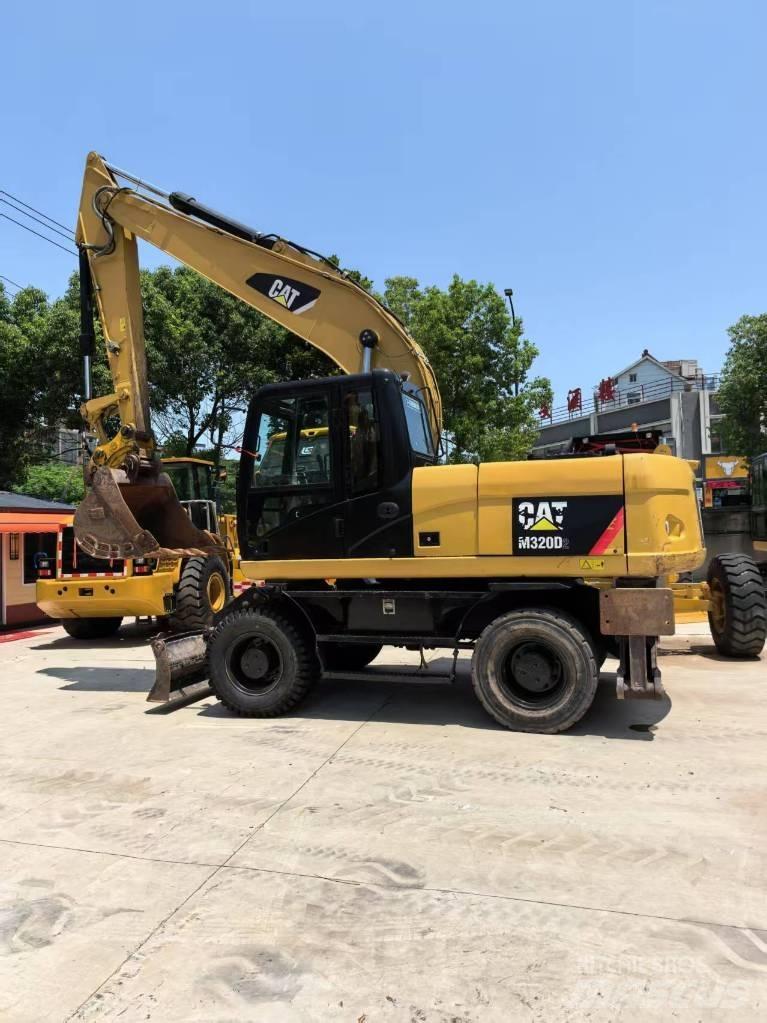 CAT M 320 Hjulgrävare