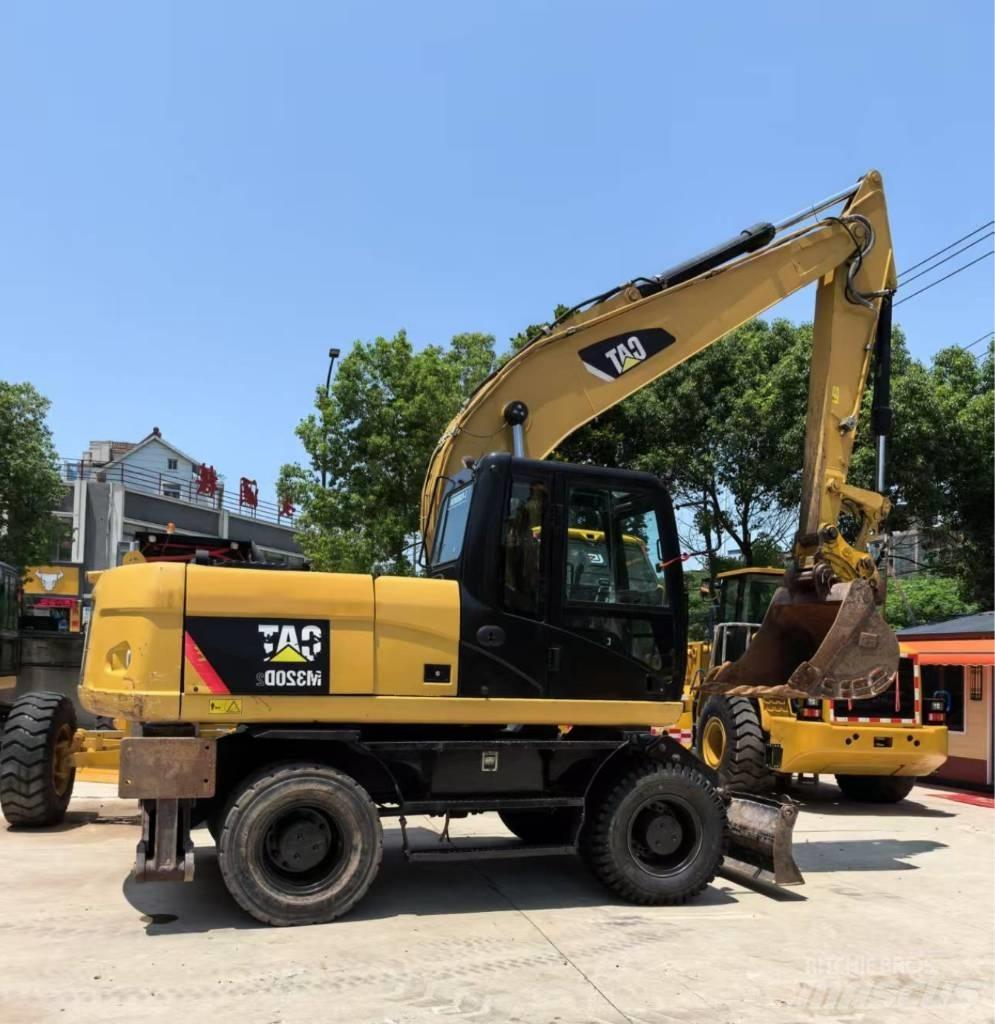 CAT M 320 Hjulgrävare