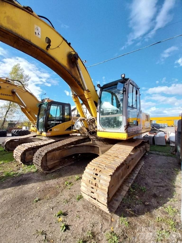 New Holland E 305 Bandgrävare