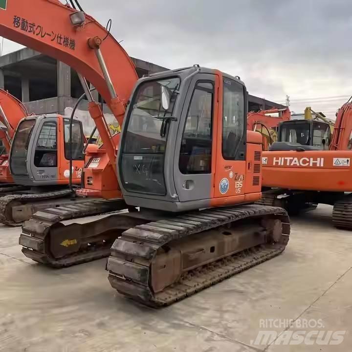 Hitachi ZX135US Bandgrävare