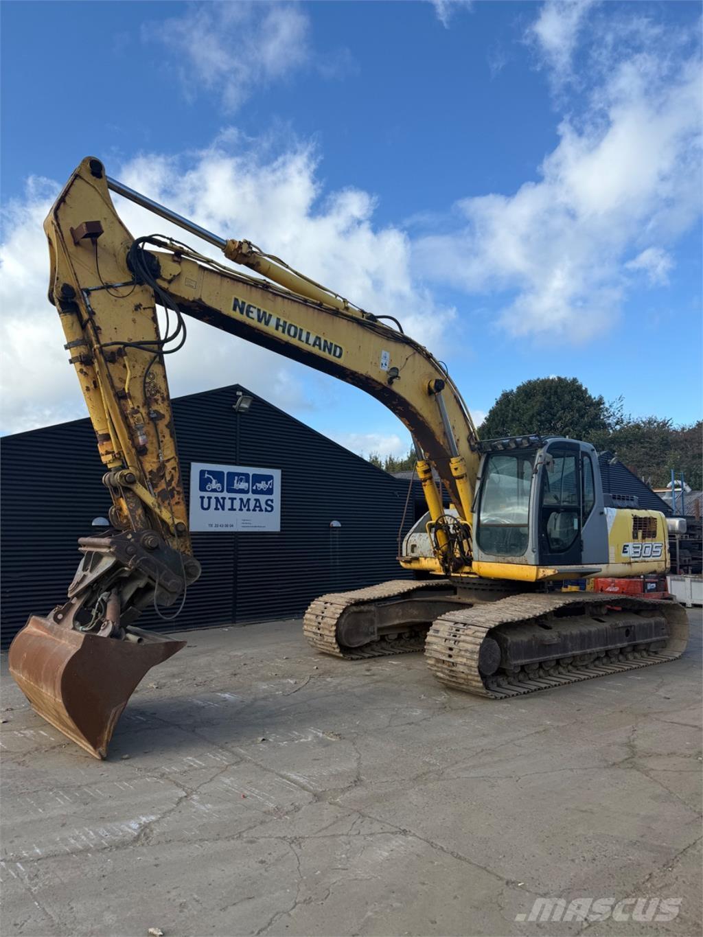 New Holland E305 Bandgrävare