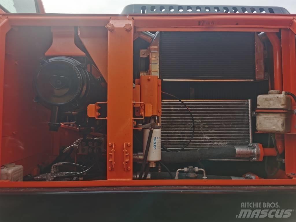 Doosan DX 225 LC-9C Bandgrävare