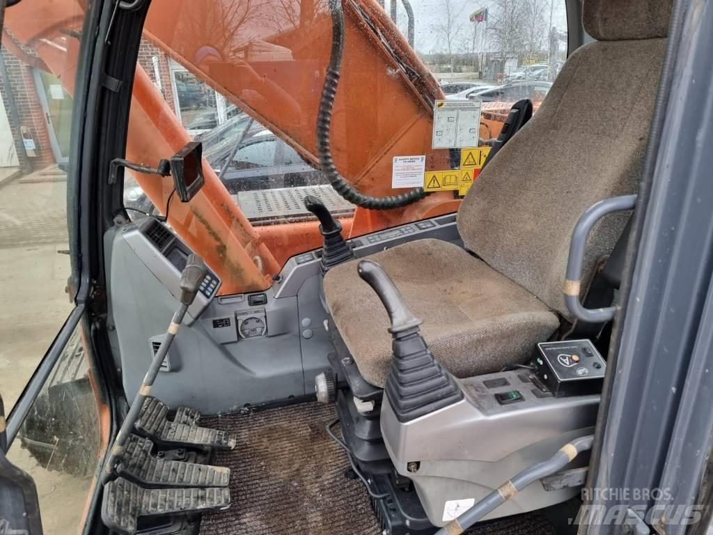 Doosan DX 225 LC Bandgrävare