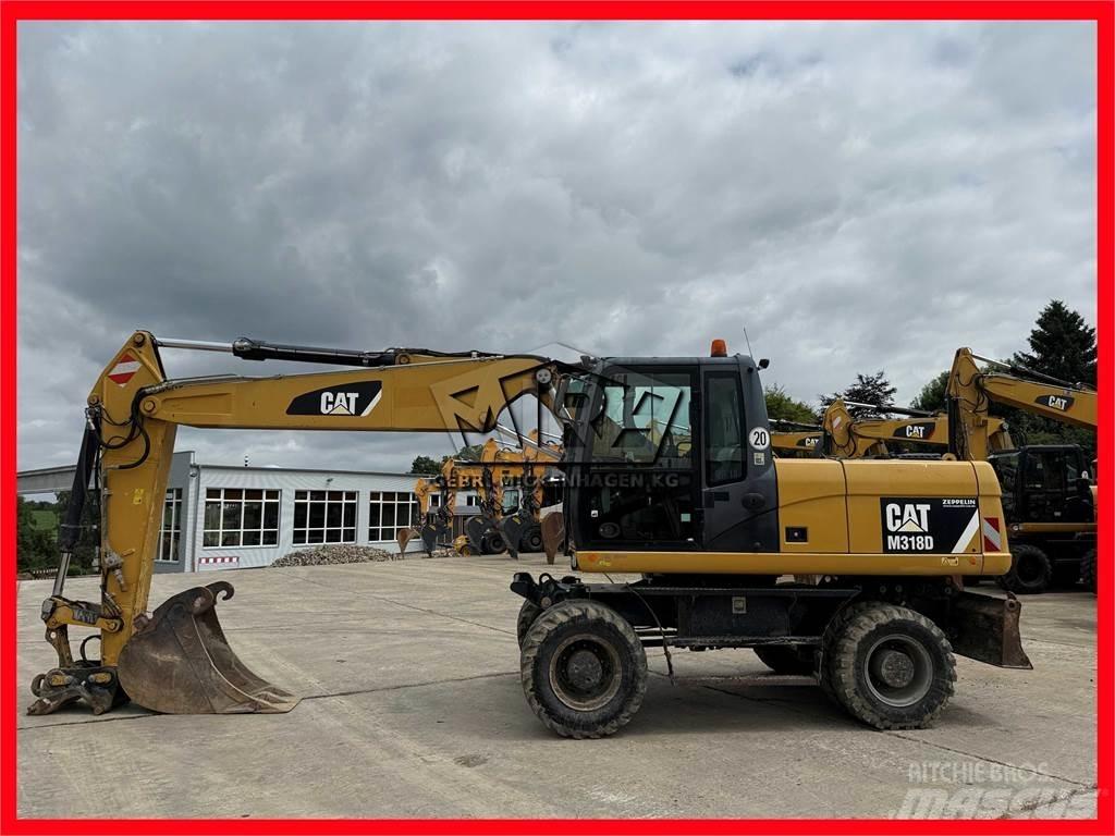CAT M 318 D Hjulgrävare