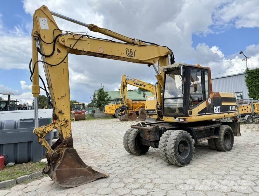 CAT M318 Hjulgrävare